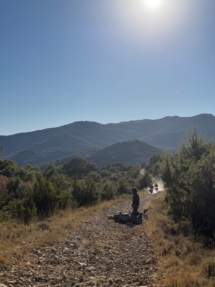 Laid it down on the gravel. Two riders already gone up the dust.